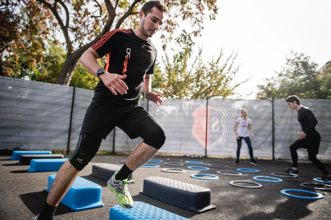 A person engaging in light exercise, like walking or jogging, in an outdoor setting.
